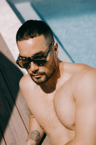 man wears light tortoiseshell large aviator sustainable and biodegradable malone quinoa sunglasses with tan lens