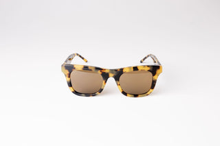 Front view of brown tortoiseshell biodegradable and sustainable sunglasses with tan lens