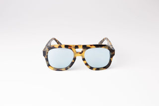 front view of dark tortoiseshell aviator biodegradable and sustainable malone brulee blue sunglasses with blue lens